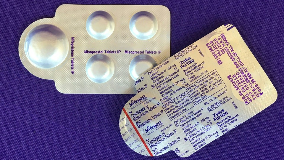 a combination pack of mifepristone (L) and misoprostol tablets, two medicines used together, also called the abortion pill.