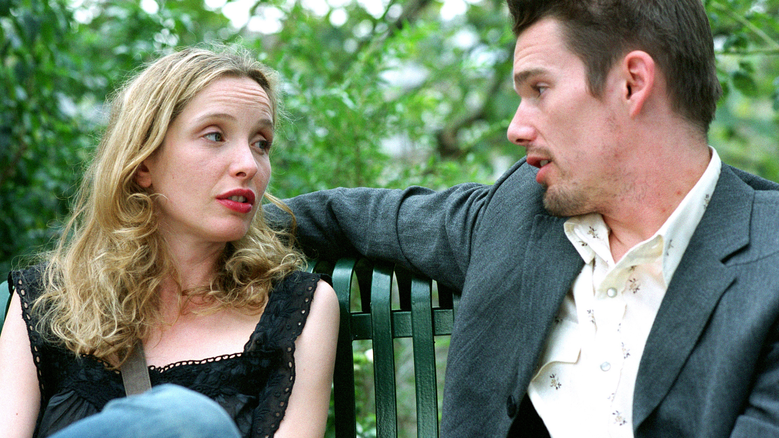 A scene from Before Sunset where a couple talks in a park