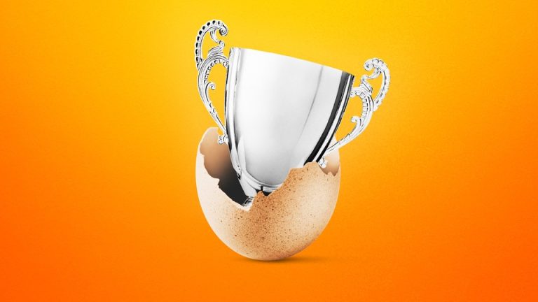 Photo-illustration of a silver trophy popping out of an egg shell