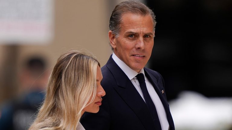 Color photograph of Hunter Biden with his wife