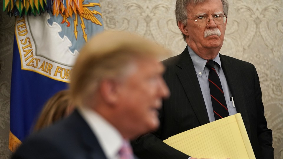 John Bolton looks at Donald Trump