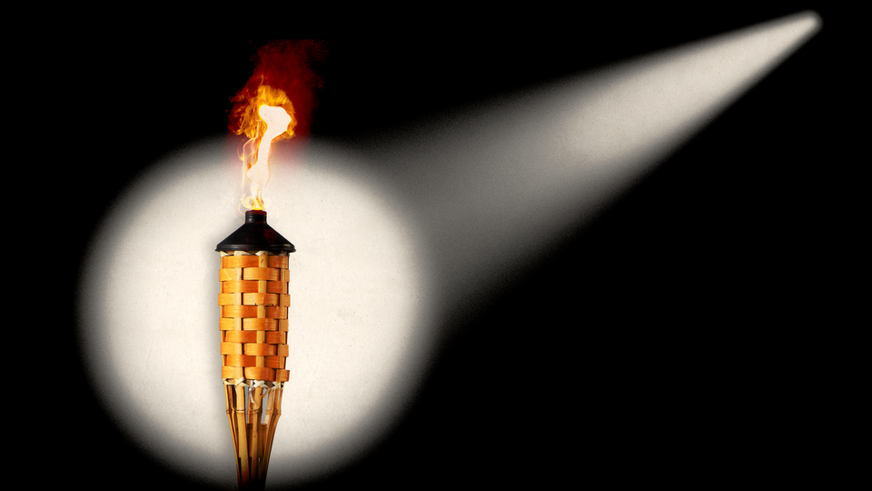 An image of a torch with a spotlight on it