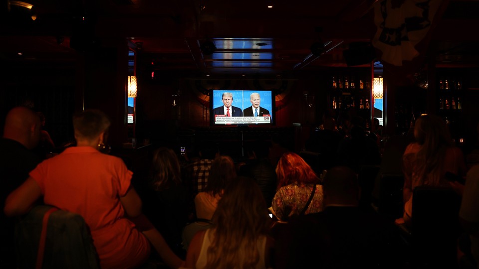 A photo of a group audience watching the CNN presidential debate.