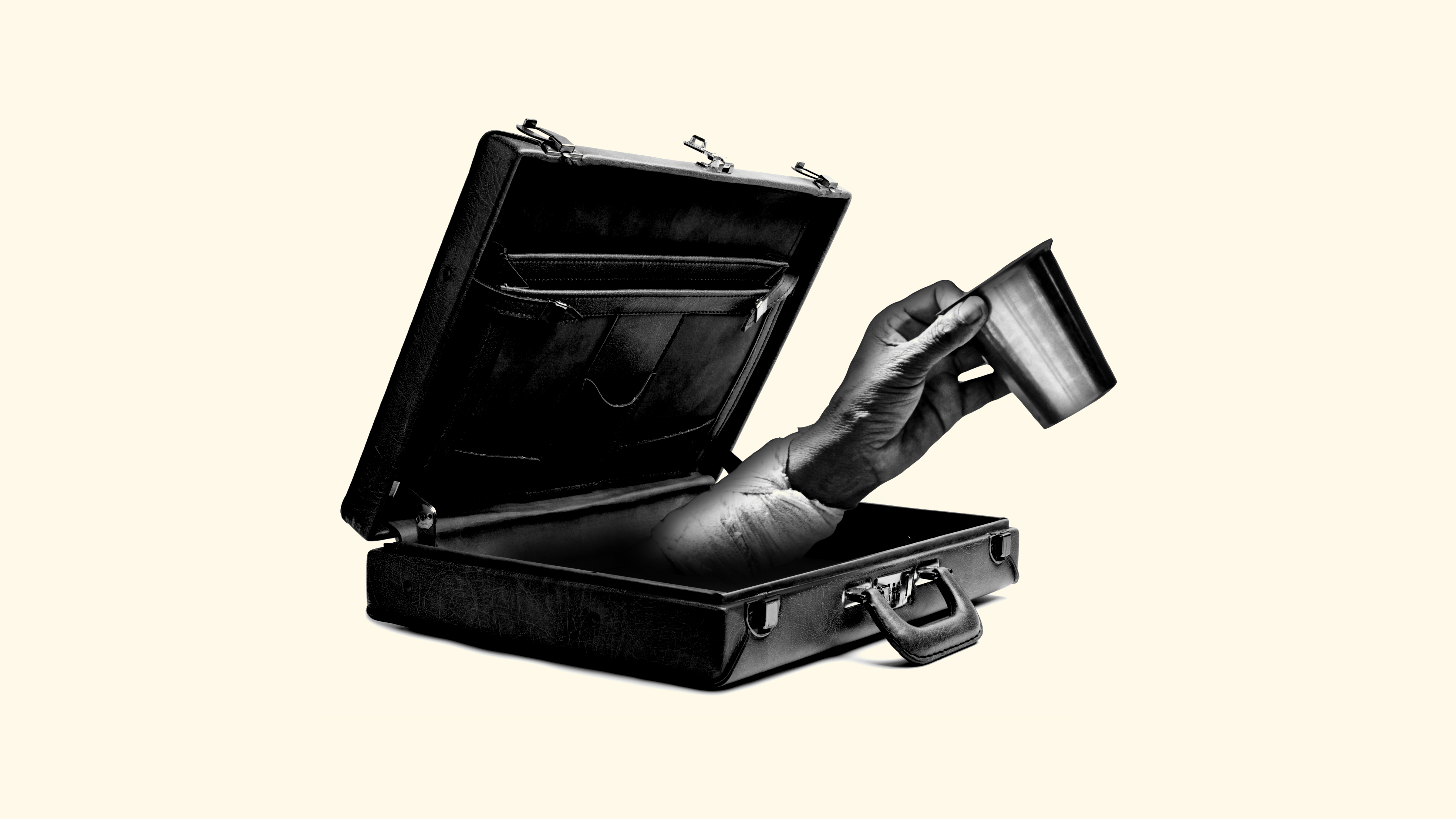 A hand reaching out of a briefcase, begging