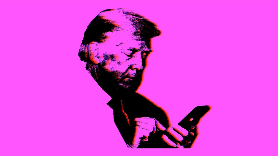 Image of Trump using a phone