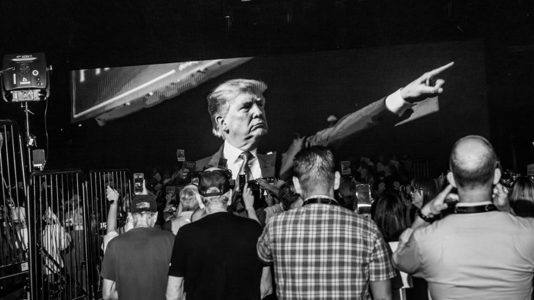 People wait to hear former president Donald Trump speak at a Turning Point–sponsored event in Phoenix on June 6.