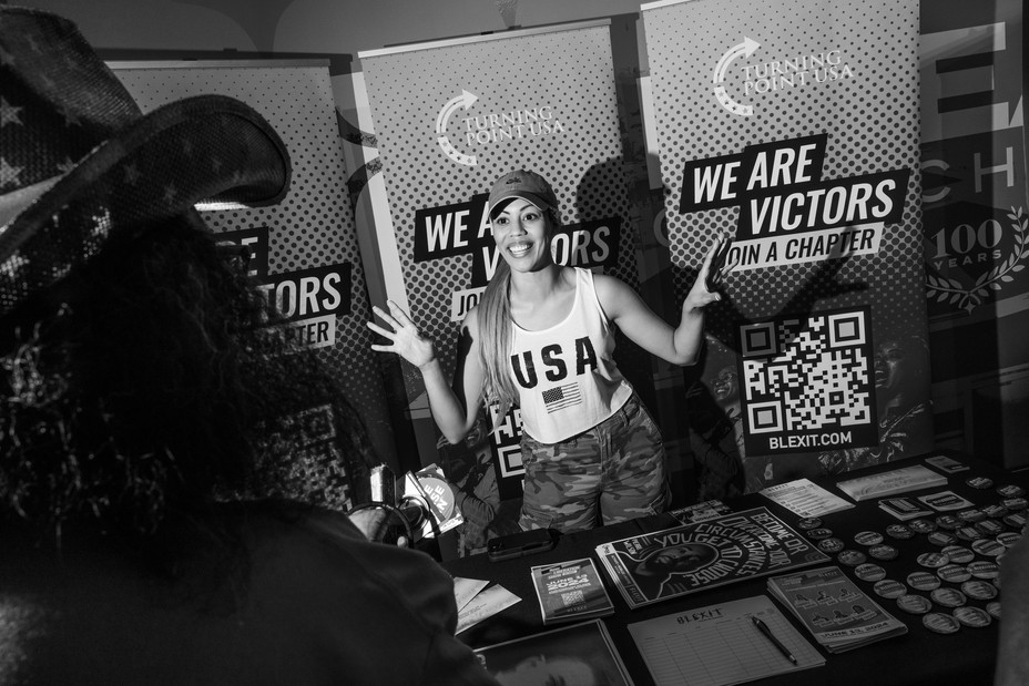 Picture of a representative from BLEXIT, a conservative campaign founded by Candace Owens to encourage African Americans to quit the Democratic Party, talks to attendees at the Chase the Vote event in Phoenix, Arizona.