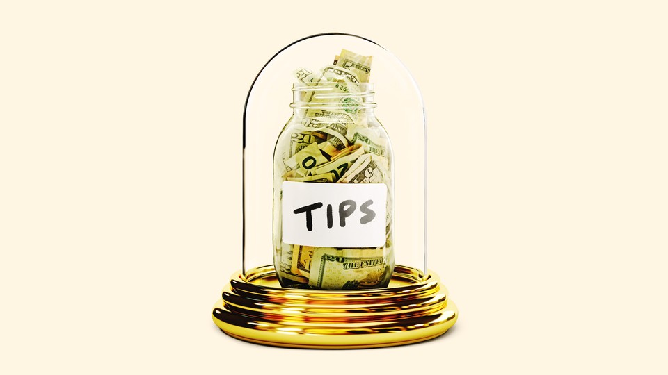 Tip jar in a glass display container