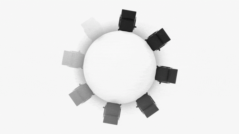 Circle of chairs around a table loading