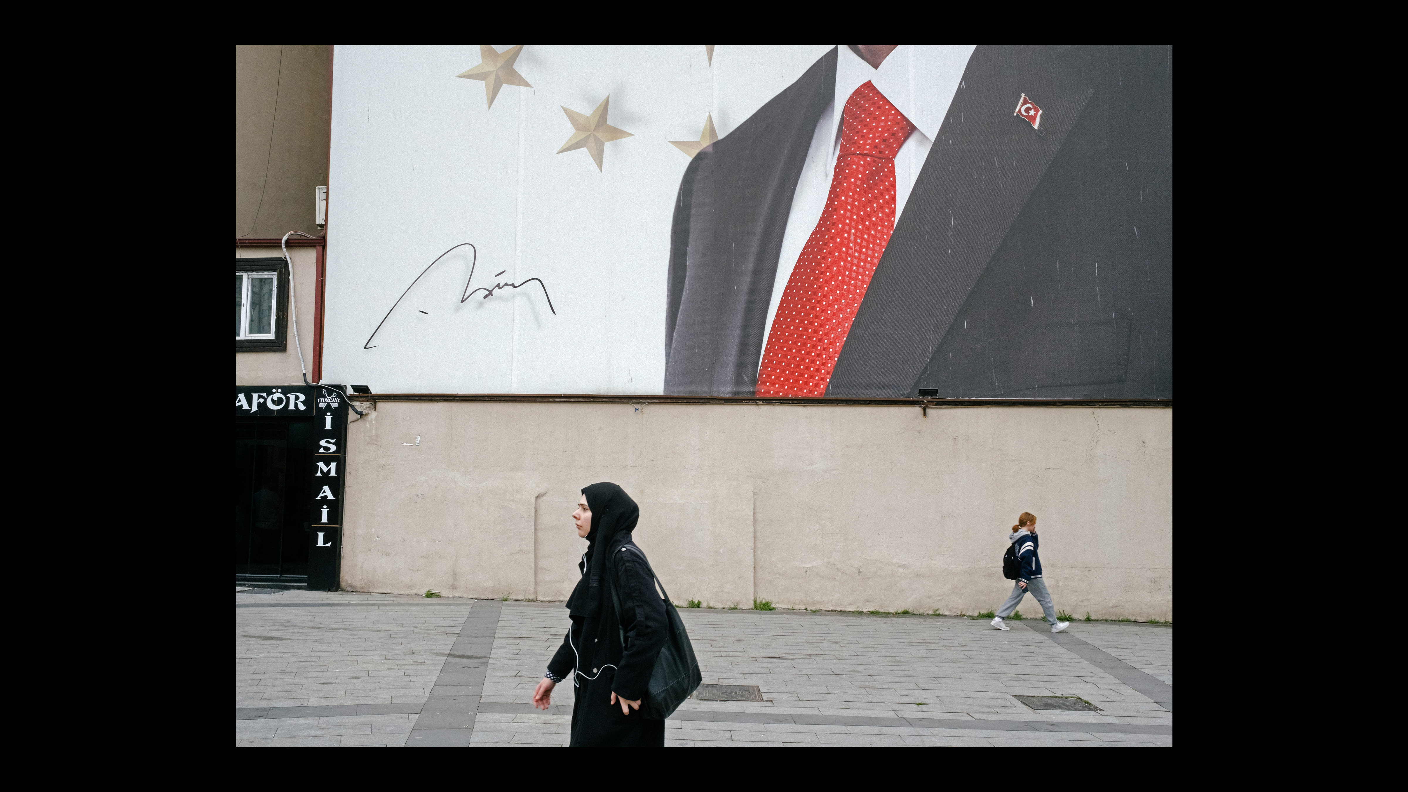 Woman in a hijab walking in a street in Turkey