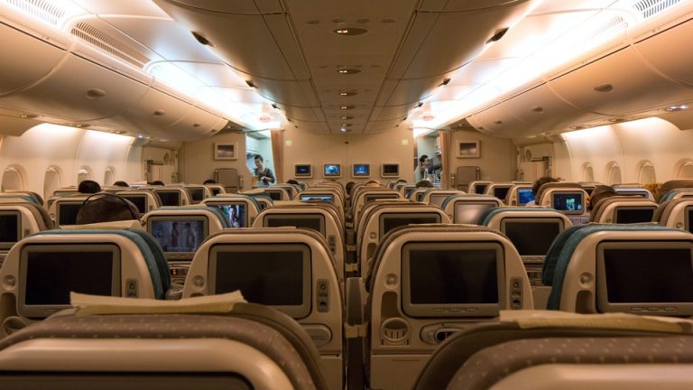 Photo of the inside of a passenger airplane cabin