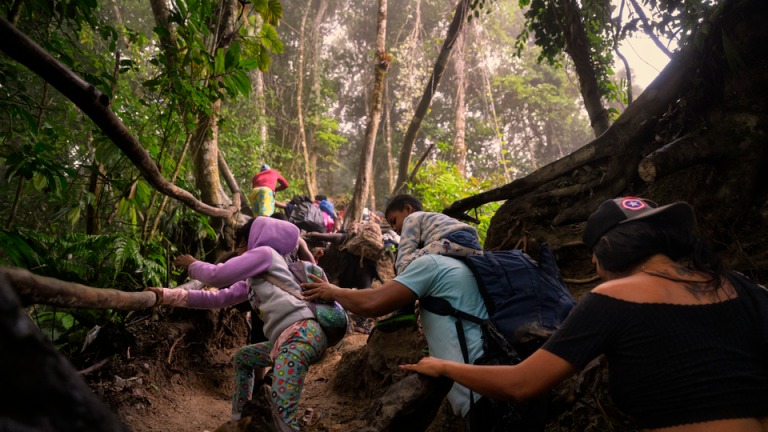 A family ascends a mountainous stretch of trail near the Colombian border with Panama.