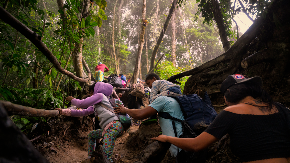 A family ascends a mountainous stretch of trail near the Colombian border with Panama.