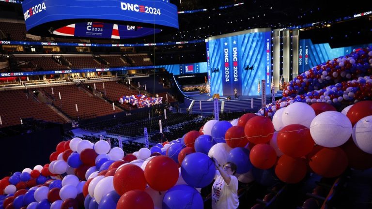 Red, white, and blue balloons fill the stadium for the DNC