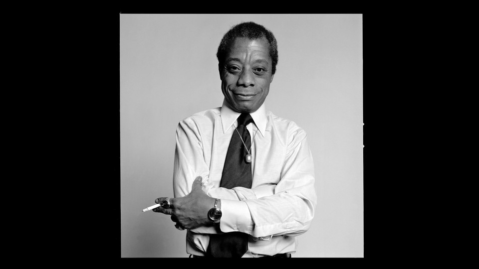 Black-and-white portrait of James Baldwin