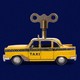 An image of a taxi with a wind-up mechanism on top