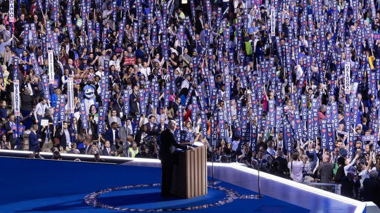 Joe Biden gives a speech at the DNC surrounded by "We Heart Joe" signs