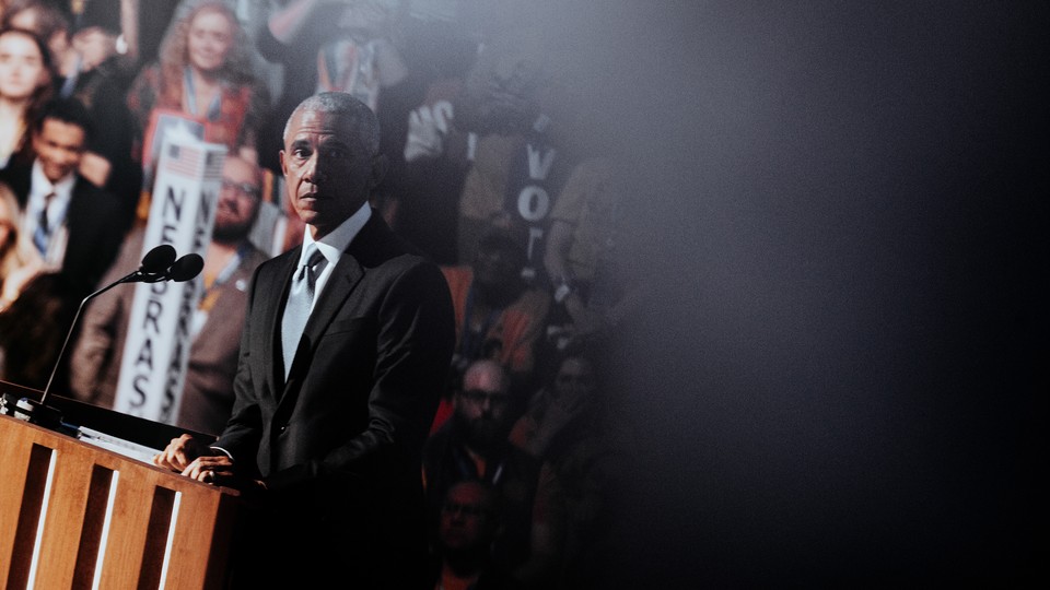 Barack Obama wearing a dark suit and tie at the Democratic National Convention