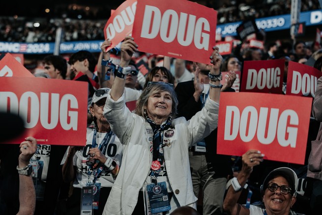 DNC attendees hold up "Doug" signs