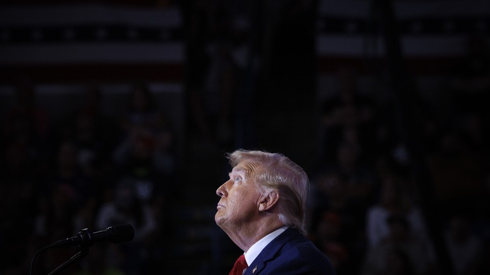 Donald Trump looks up during a campaign event