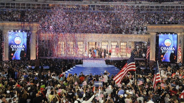 Streamers erupt at the 2008 DNC convention while people cheer