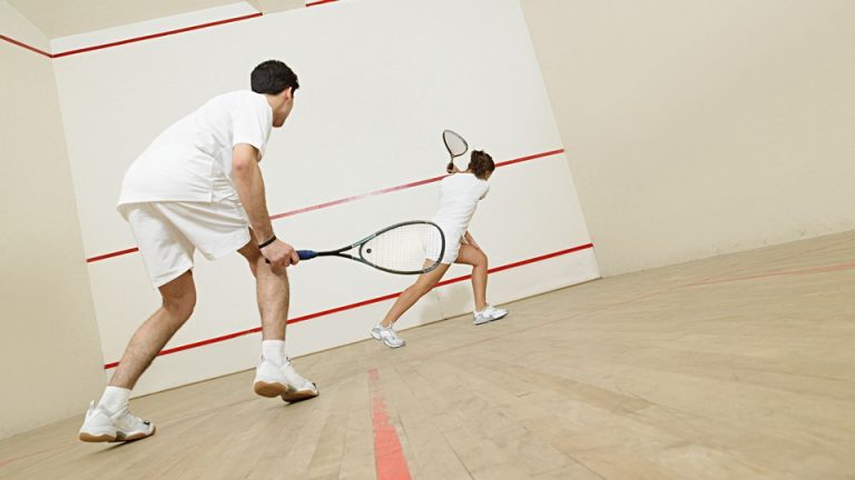 Two people playing squash