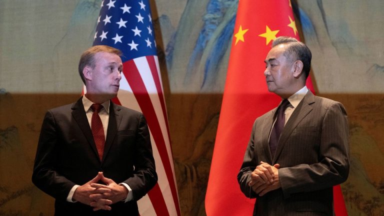 A photo showing U.S. National Security Adviser Jake Sullivan and Chinese Foreign Minister Wang Yi looking at each other.