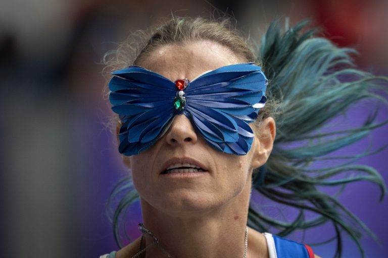 A runner wears a butterfly-shaped blindfold while competing at the Paralympic Games.