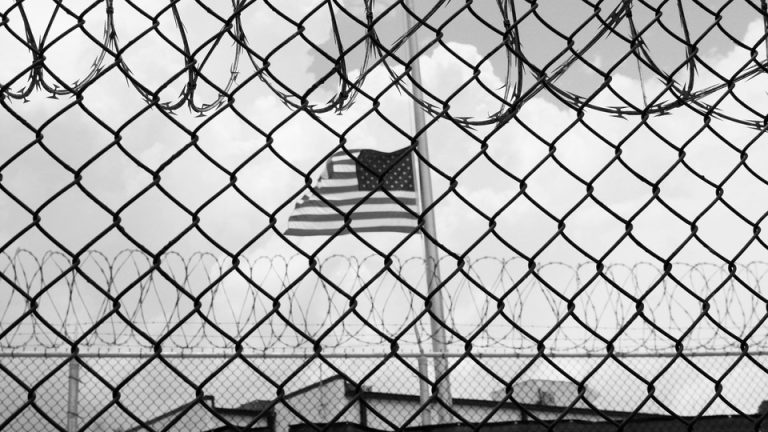 An American flag flies over Camp 6 detention center in Guantánamo Bay, Cuba