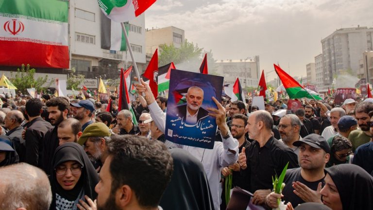 Iranians attend a funeral procession for the Hamas leader Ismail Haniyeh in Tehran on August 1.