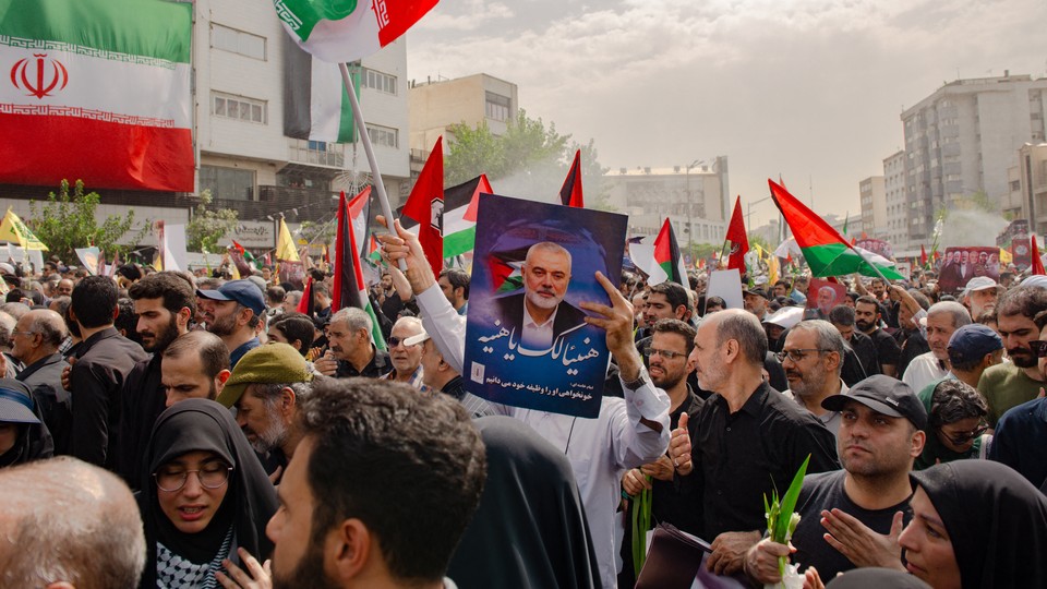 Iranians attend a funeral procession for the Hamas leader Ismail Haniyeh in Tehran on August 1.