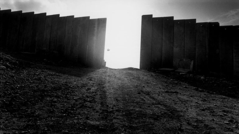 Picture of the wall surrounding a West Bank settlement