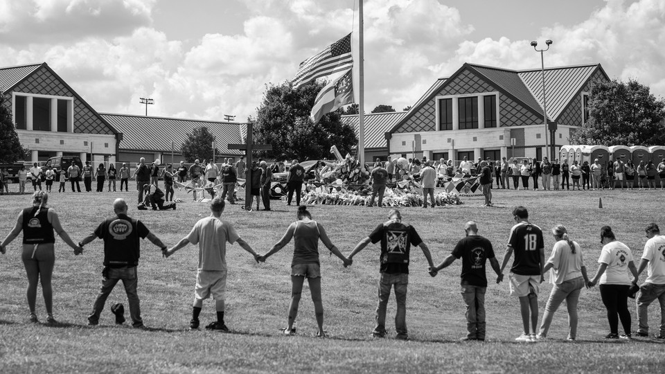 A news photo of a vigil at Apalachee High School, Georgia, marking a recent mass shooting there.