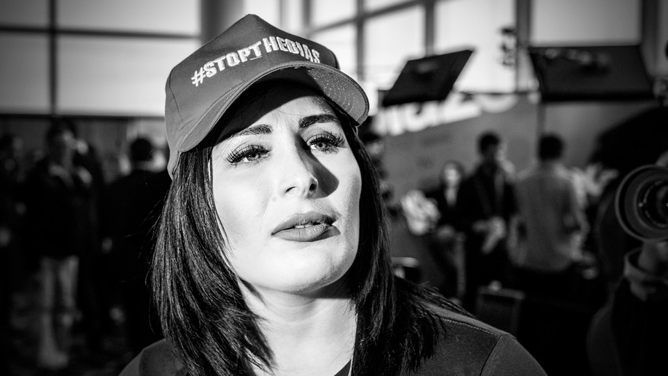 Laura Loomer wearing a ballcap reading "#Stopthebias"