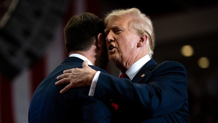 Trump hugging JD Vance, and whispering something to his ear