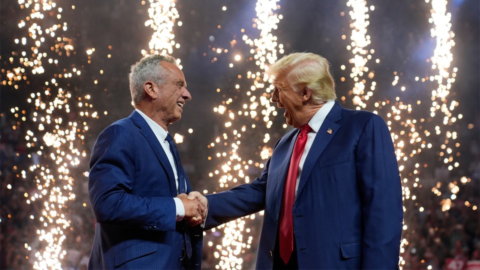 Robert F. Kennedy Jr. shaking hands with Donald Trump