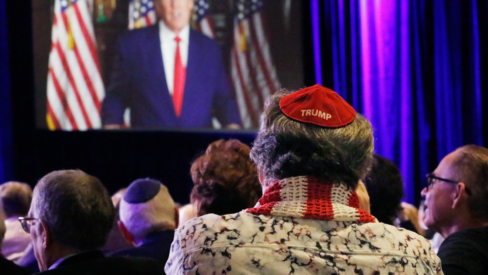 A Jewish Trump supporter looks on