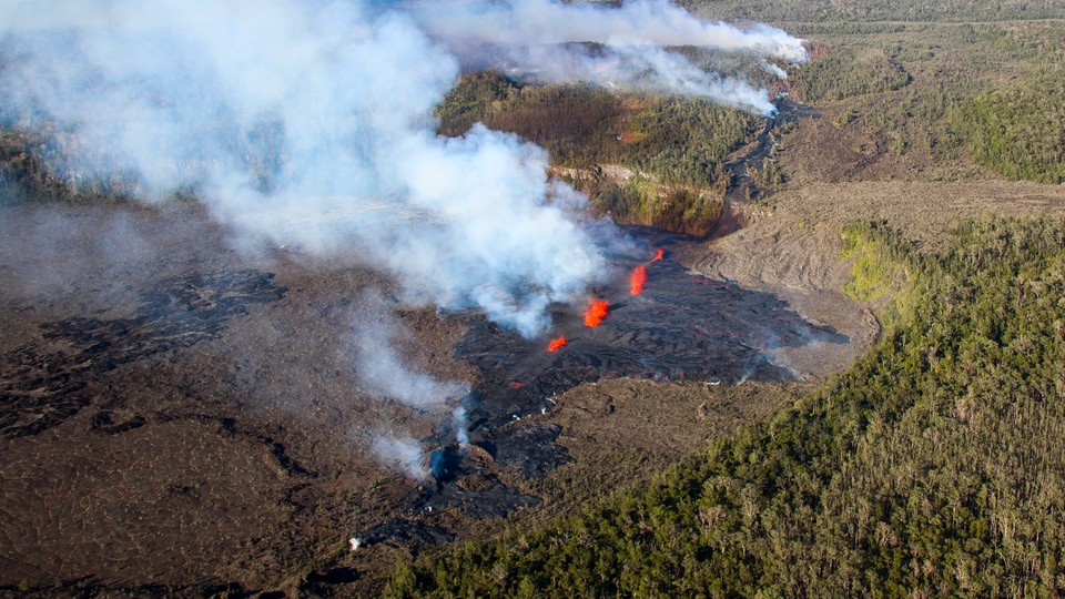 A fissure in Hawaii leaking bright orange lava