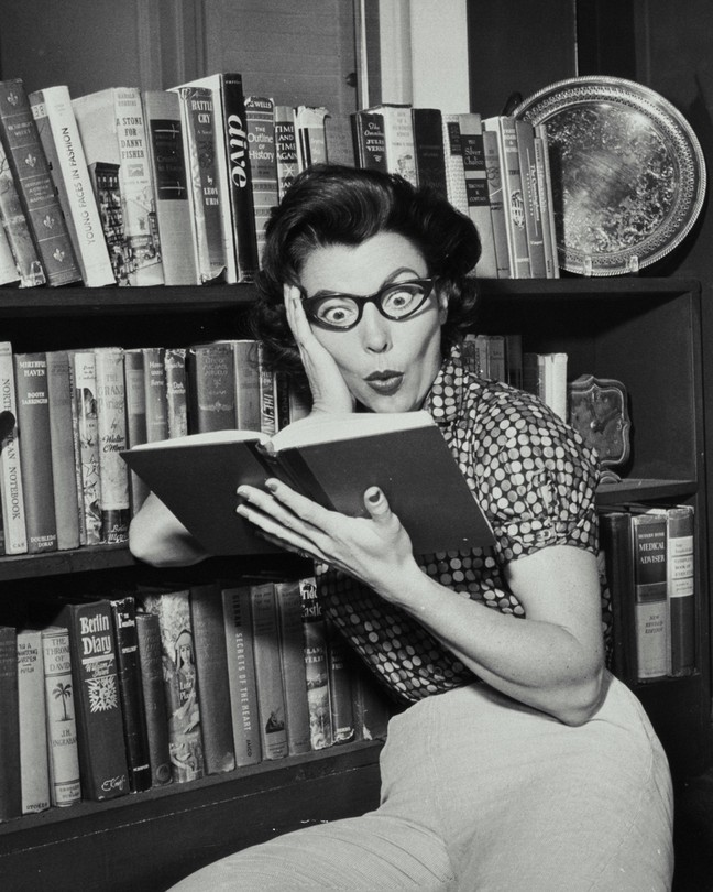 A black and white photo of a shocked woman