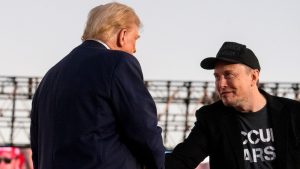 Donald Trump and Elon Musk shaking hands