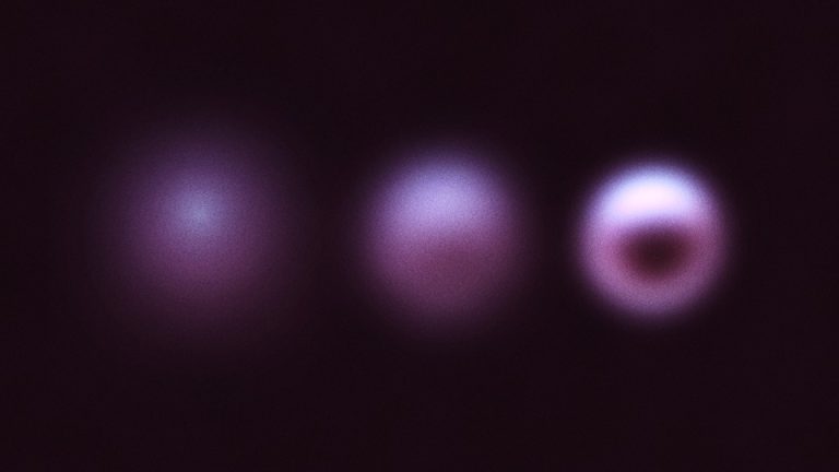 Illustration of three purple circles against a black background, getting clearer from left to right