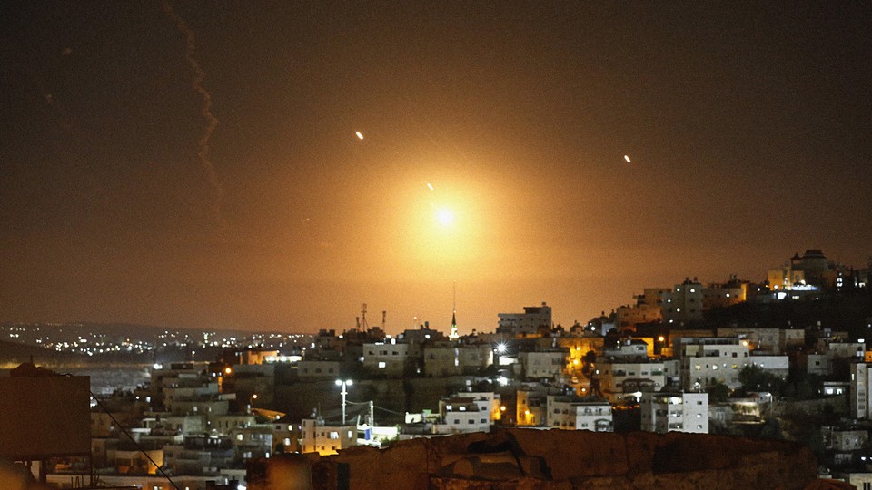 Iranian missiles light up the night sky over Hebron in the West Bank.