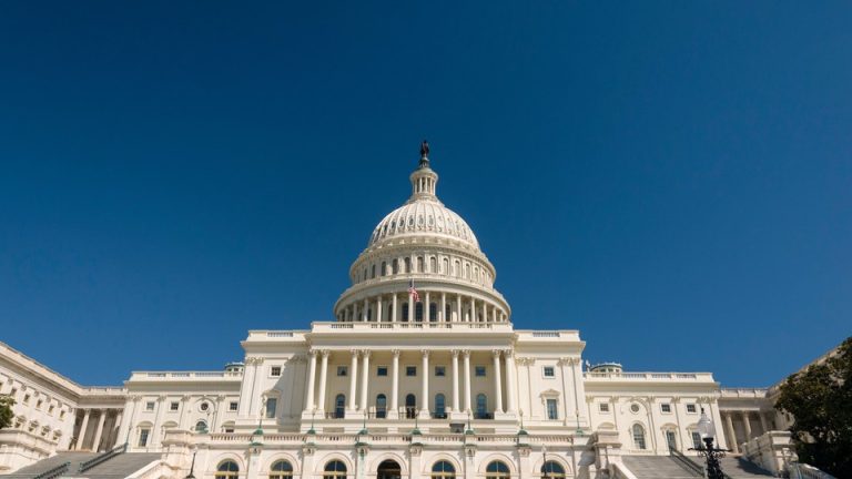 The U.S. Capitol under a vast blue sky