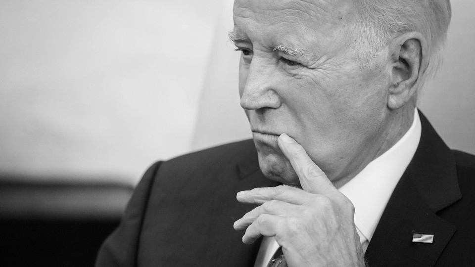 A black-and-white photo of President Joe Biden looking pensive