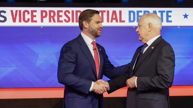 J. D. Vance and Tim Walz shake hands at the debate