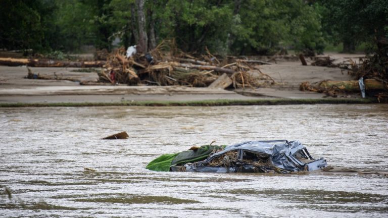 A destroyed car floats in floodwaters in Chimney Rock, North Carolina, in the aftermath of Hurricane Helene.