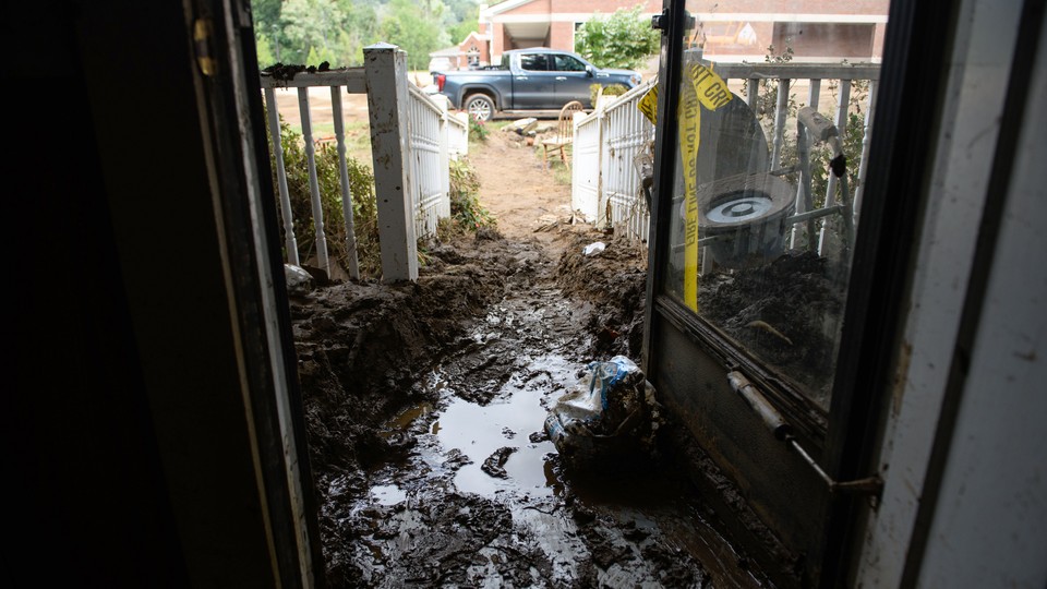 A flooded and muddy entryway in a house in North Carolina