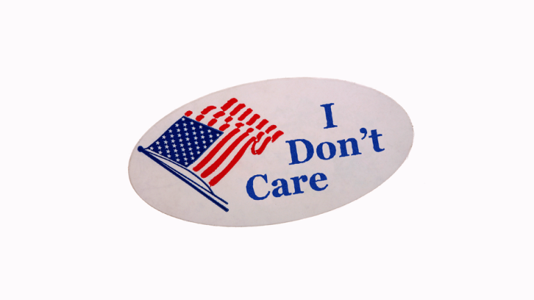 An oval sticker with an American flag and the words "I don't care" in blue.