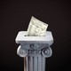 Illustration of a ballot being cast in a marble pillar