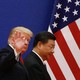 Trump and Xi are positioned in front of an American flage